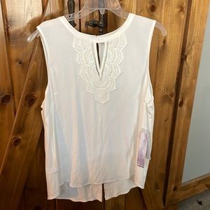 NWT cute white lacy sleeveless blouse. Great for work
